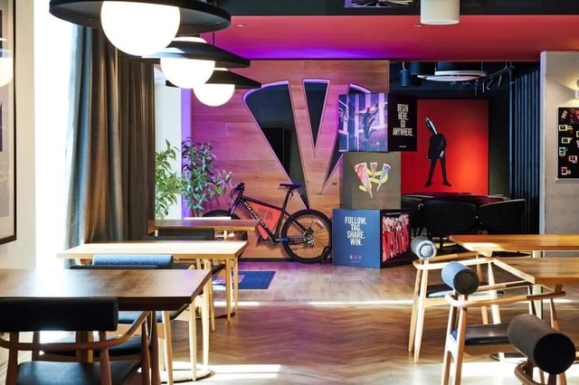 Bicycle and lounge area with tables and chairs Communal area at Vita Student Park Place in Cardiff Student Accommodation