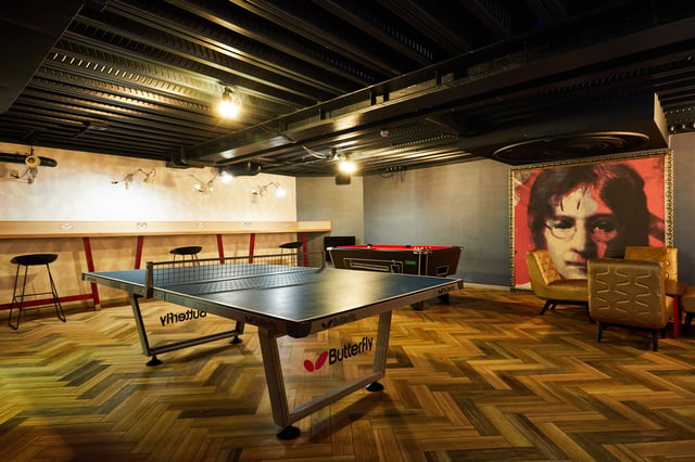 Ping pong table pool table artwork lounge area playing area at Vita Student Crosshall Street in Liverpool Student Accommodation