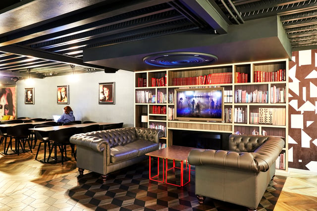 Chesterfield sofas and bookshelves living area at Vita Student Crosshall Street in Liverpool Student Accommodation