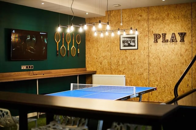 Ping pong table tennis rackets and television Playing area at Vita Student Lawrence Street in York Student Accommodation