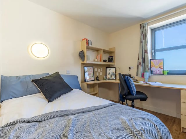 Bed desk shelf window and chair bedroom at Europa in Liverpool Student Accommodation