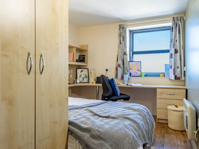 Wardrobe bed desk chair window study area at Europa in Liverpool Student Accommodation