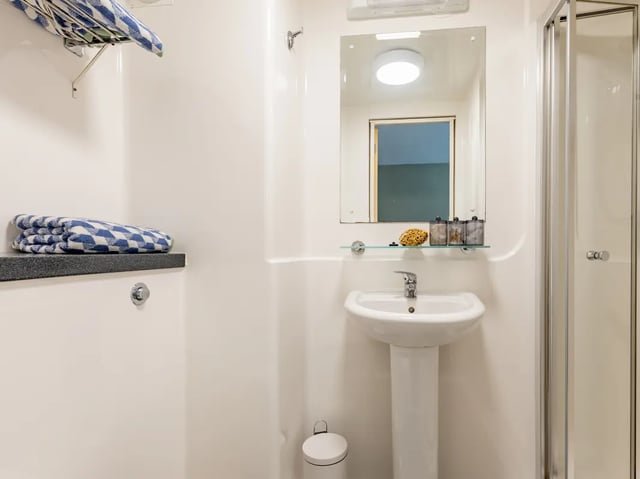Sink mirror towels and shower enclosure bathroom at Europa in Liverpool Student Accommodation