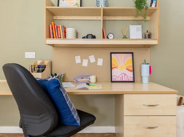 Desk with chair books and artwork study area at Europa in Liverpool Student Accommodation