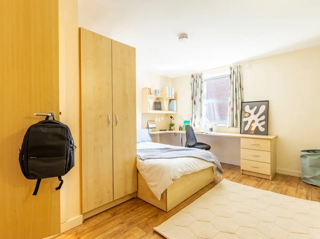 Bed desk closet with backpack bedroom at Europa in Liverpool Student Accommodation
