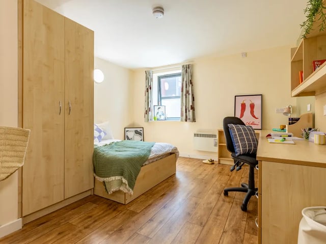 Bed desk wardrobe and chair student bedroom at Europa in Liverpool Student Accommodation