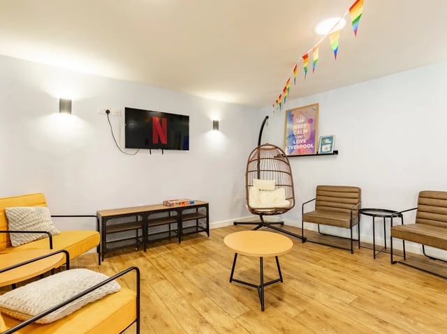 Netflix TV yellow chairs swing seat living room at Europa in Liverpool Student Accommodation