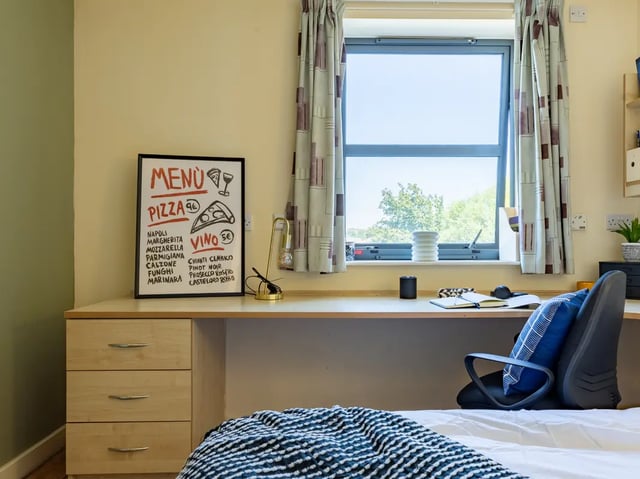 Desk with menu and chair study area at Europa in Liverpool Student Accommodation
