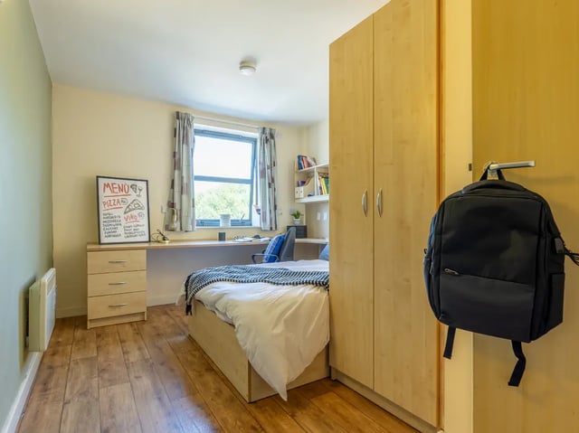 Bed wardrobe desk and chair bedroom at Europa in Liverpool Student Accommodation