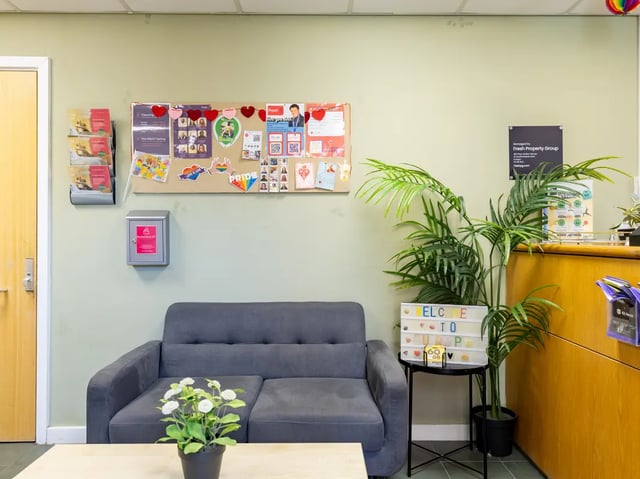 Sofa bulletin board plant welcome sign living room at Europa in Liverpool Student Accommodation