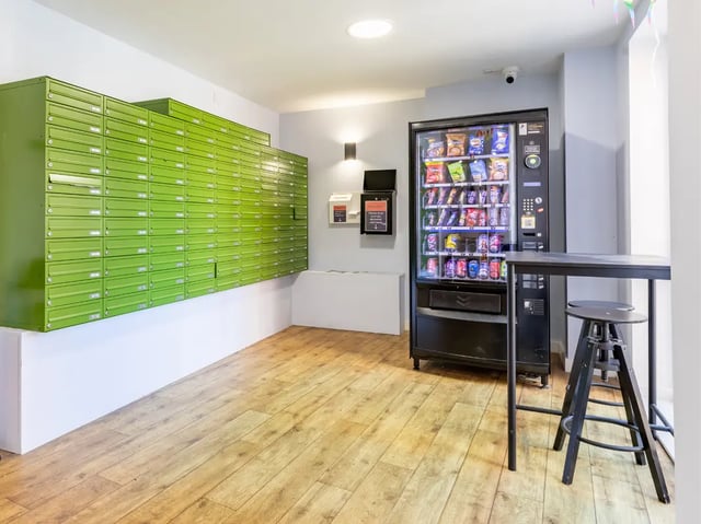 Mailboxes vending machine stool and table common area at Europa in Liverpool Student Accommodation