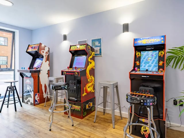 Arcade machines and stools playing area at Europa in Liverpool Student Accommodation
