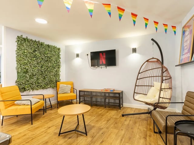 Yellow chairs hanging chair Netflix TV living room at Europa in Liverpool Student Accommodation