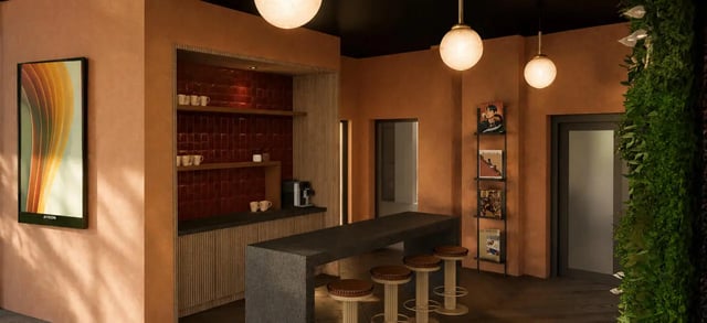 Counter with stools artwork and vertical garden lounge at Compass in Birmingham Student Accommodation