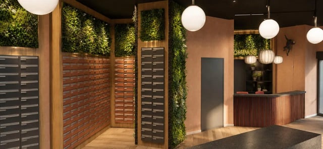 Mailboxes and reception area with plants exterior at Compass in Birmingham Student Accommodation
