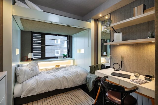 Bed desk and shelves in student room at The Stay Club - Kentish Town in London Student Accommodation