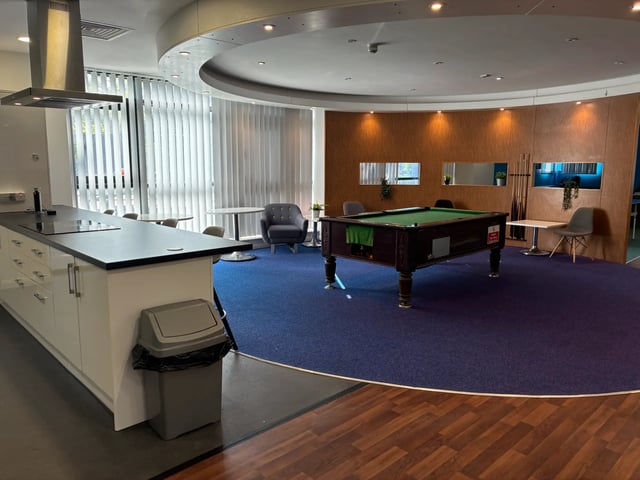 Kitchen island billiard table and seating area living room at Newport Student Village in Newport Student Accommodation