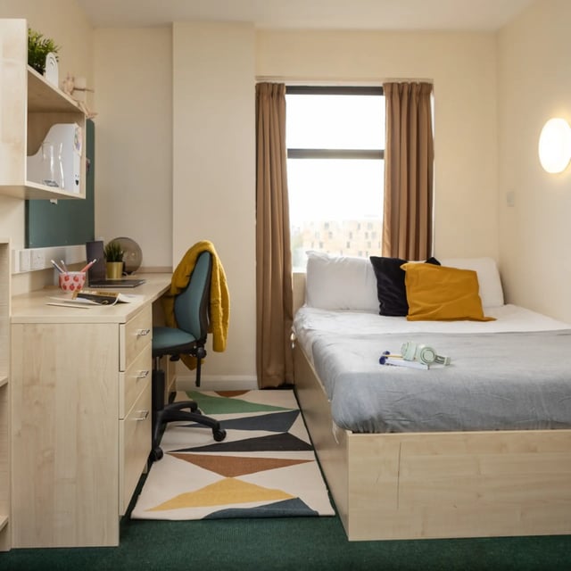 Desk bed chair rug headphones bedroom at Newport Student Village in Newport Student Accommodation