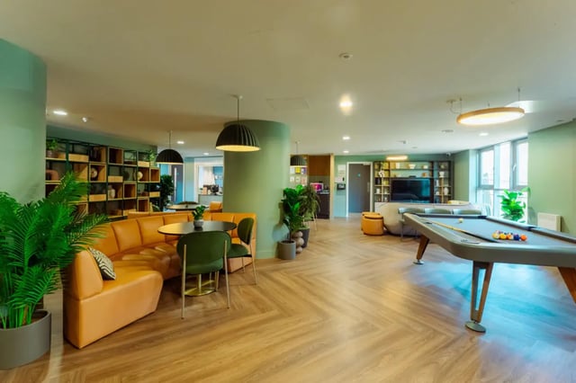 Pool table sofas tables and plants common area at St Peters Court in Nottingham Student Accommodation