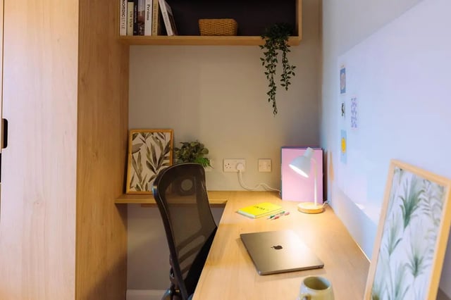 Desk with laptop lamp and artwork Study area at St Peters Court in Nottingham Student Accommodation