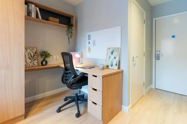 Desk chair whiteboard plants picture study area at St Peters Court in Nottingham Student Accommodation