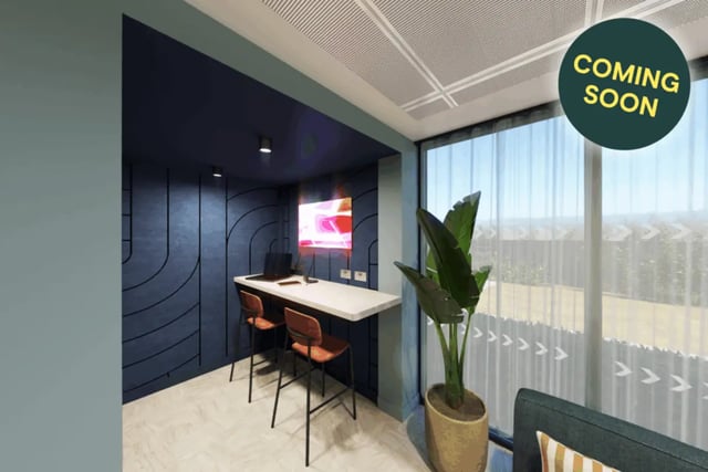 Desk with stools and a television study area at St Peters Court in Nottingham Student Accommodation