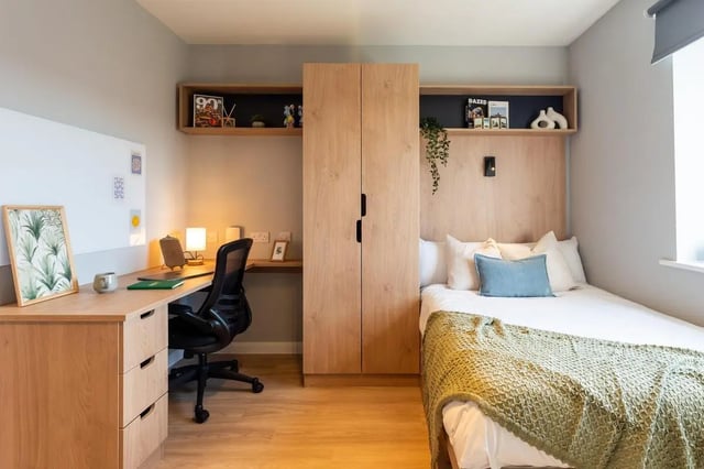 Desk chair bed wardrobe shelves bedroom at St Peters Court in Nottingham Student Accommodation