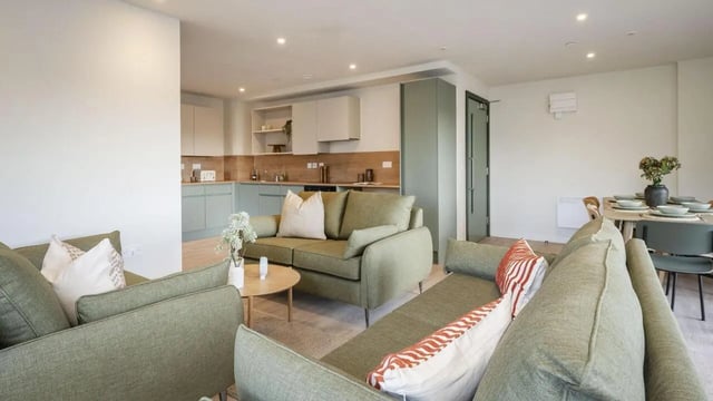 Sofa kitchen dining table living room at City Wharf in Glasgow Student Accommodation