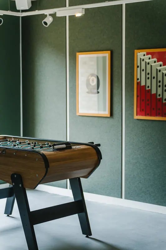 Foosball table on floor with wall art playing area at City Wharf in Glasgow Student Accommodation