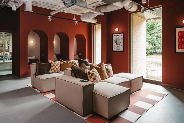 Modular sofas with patterned cushions and ottomans communal area at City Wharf in Glasgow Student Accommodation