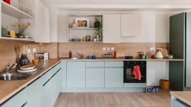 Modern light blue kitchen with oven and toaster kitchen at City Wharf in Glasgow Student Accommodation