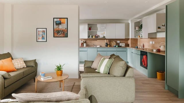 Sofa kitchen cabinets oven and toaster Living area at City Wharf in Glasgow Student Accommodation