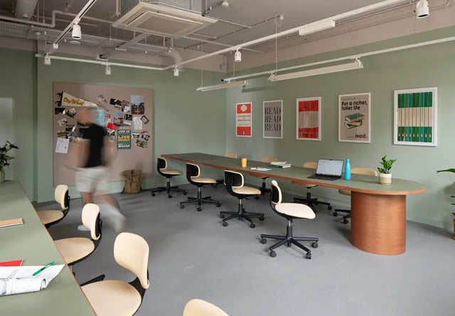 Long table with chairs and posters study area at City Wharf in Glasgow Student Accommodation
