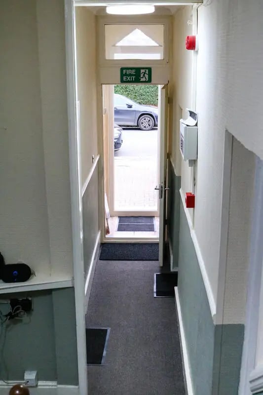 Fire exit sign red alarm hallway exterior at 42 Disraeli Rd E7 9JP in London Student Accommodation