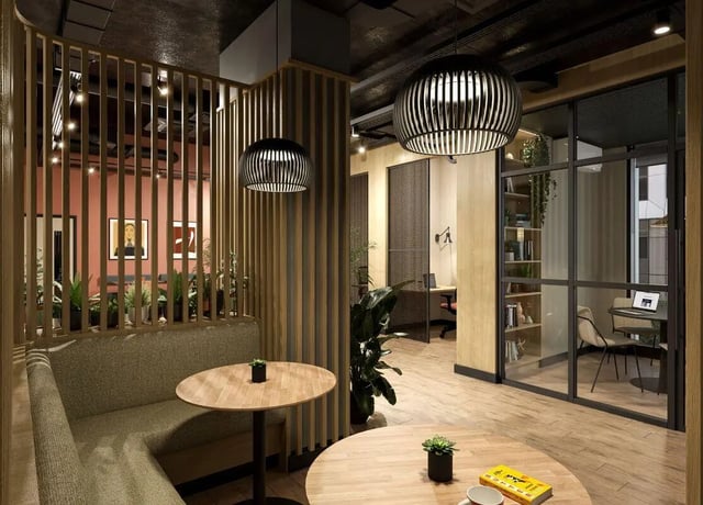 Booth seating and round tables communal area at Fusion Leeds in Leeds Student Accommodation
