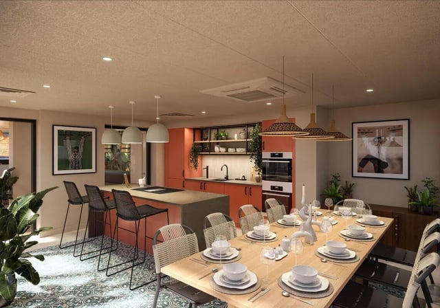 Dining table and kitchen bar area kitchen at Fusion Leeds in Leeds Student Accommodation
