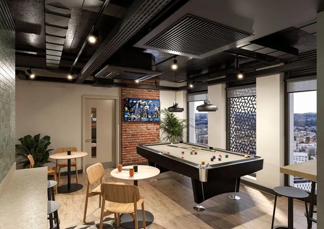 Pool table chairs TV and plants recreation area at Fusion Leeds in Leeds Student Accommodation