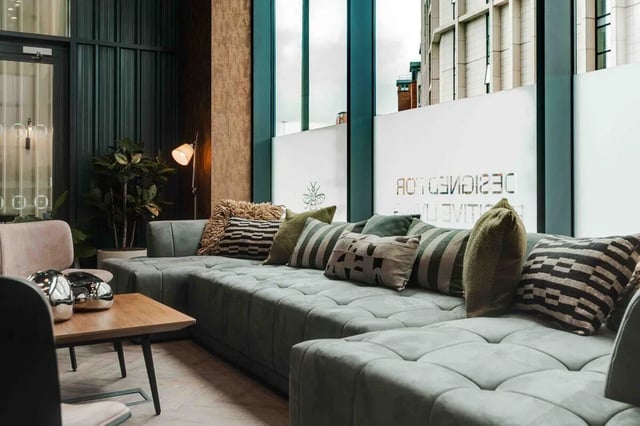 Large sectional sofa with pillows living room at Fusion Manchester in Manchester Student Accommodation