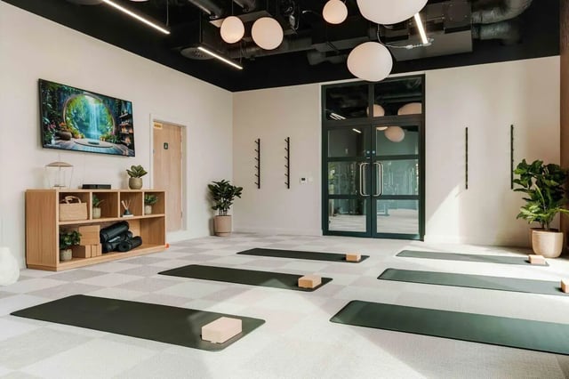 Yoga mats and storage unit workout area at Fusion Manchester in Manchester Student Accommodation