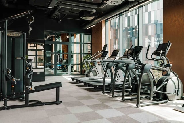 Gym equipment treadmills elliptical machines exercise bench gym area at Fusion Manchester in Manchester Student Accommodation