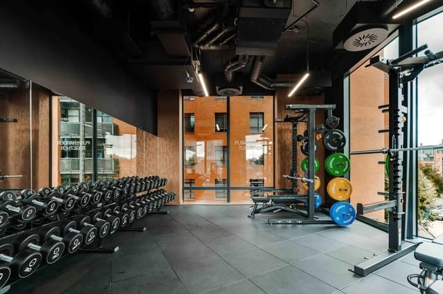 Dumbbells weight rack and bench Gym area at Fusion Manchester in Manchester Student Accommodation