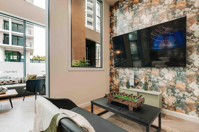 Foosball table TV and sofa living room at Fusion Manchester in Manchester Student Accommodation