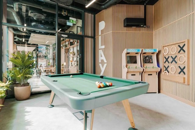 Pool table arcade games and tic tac toe area at Fusion Manchester in Manchester Student Accommodation