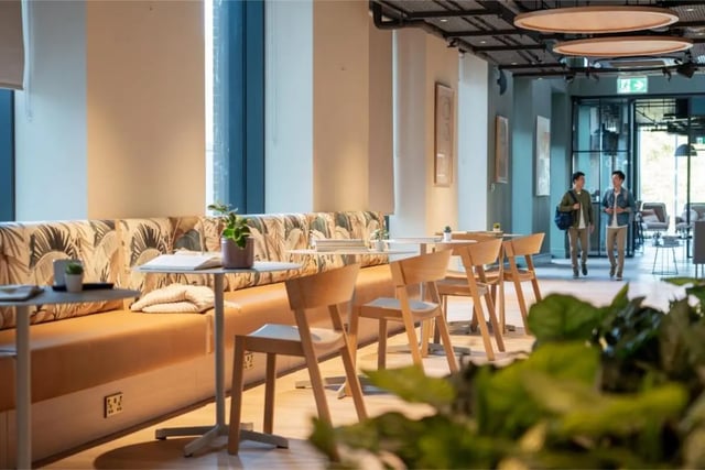 Sofa with plant and tables communal area at Fusion Students Brent Cross in London Student Accommodation