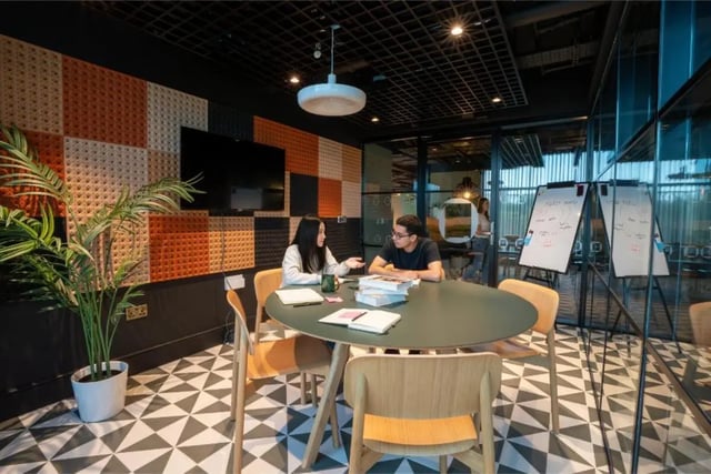 Students at table with whiteboard study area at Fusion Students Brent Cross in London Student Accommodation