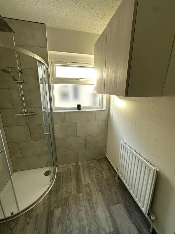 Shower cabinet window radiator bathroom at E16 3LL, MacGregor Rd, London in London Student Accommodation