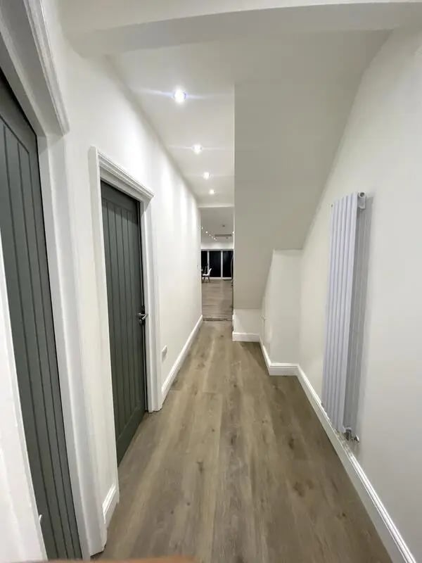 Hallway with doors and radiator hallway at E7 8PF, Shaftsbury Rd, London in London Student Accommodation