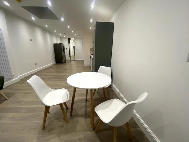 White table chairs and kitchen area at E7 8PF, Shaftsbury Rd, London in London Student Accommodation
