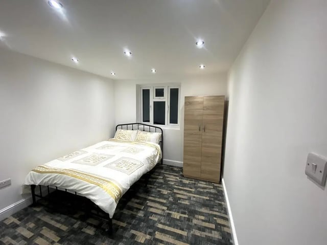 Bed wardrobe window patterned carpet bedroom at E7 8PF, Shaftsbury Rd, London in London Student Accommodation