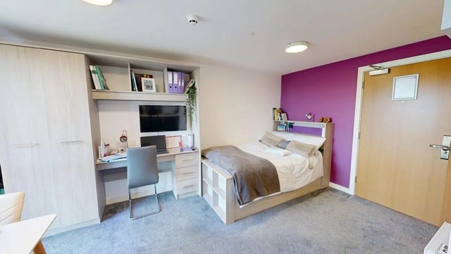 Wardrobe desk bed and door bedroom at Unity Square in Liverpool Student Accommodation